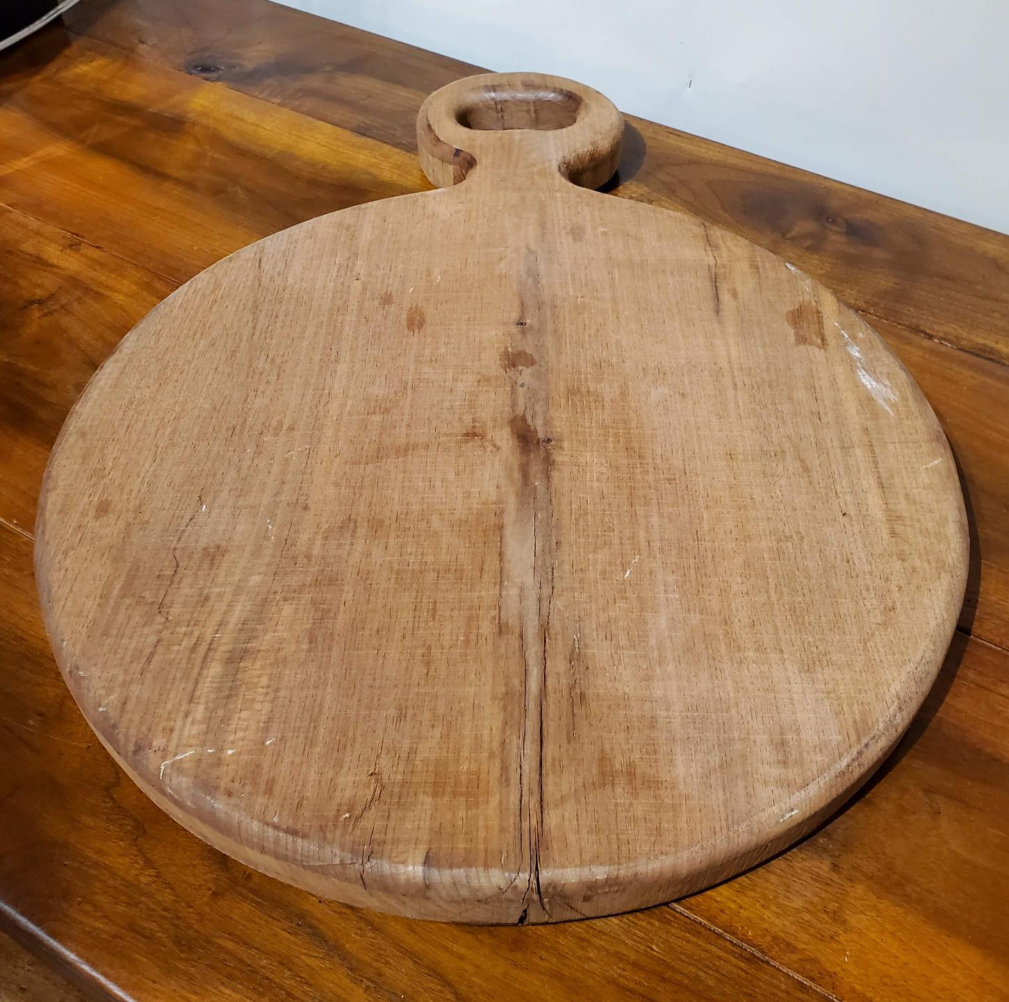 Modern Bread Board made from one large piece of Virginia Black Walnut. Use it for its original purpose, as a charcuterie board during parties or just hang on the kitchen wall for a rustic looking decoration. This bread board is study and has some