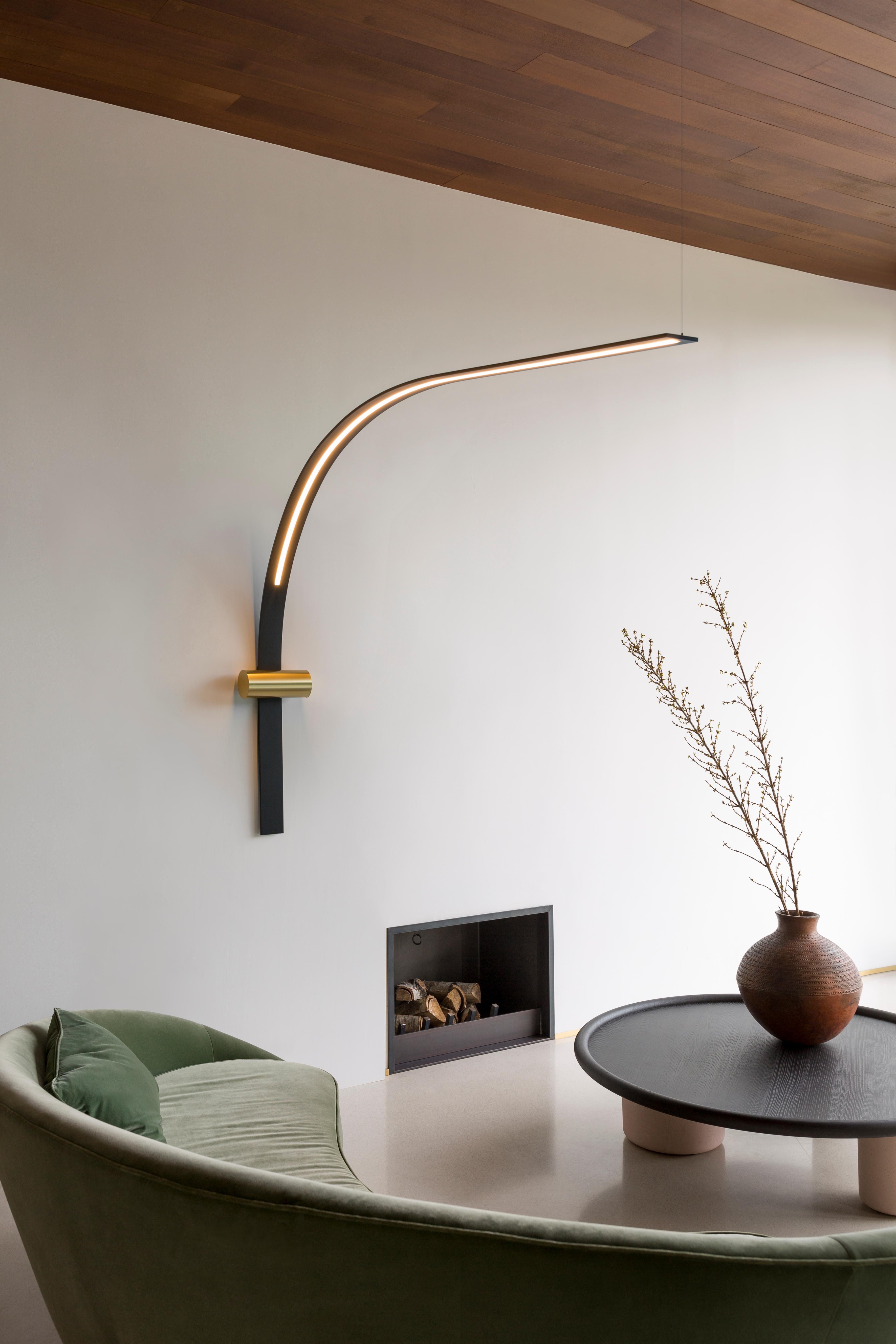Wall lamp Nastro 563.46 by TOOY
Designer: Studiopepe

Model shown: Sand Balck hardware + Beige cylinder
Dimensions: H. 130 x W. 138 x D. 25 cm
Source light: 1 x LED 220/240V Compliant with US electric system

The Nastro wall lamps sees an epoxy