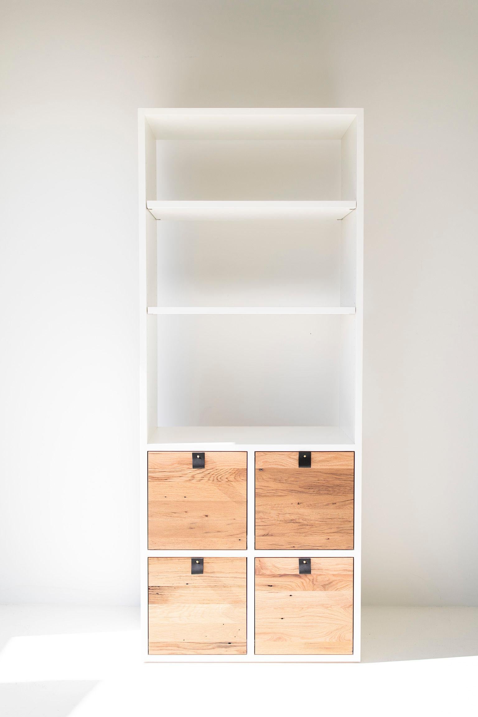 Sorry, we are no longer offering reclaimed oak. If you like this design, please contact us for pricing on other wood species!

This modern wall unit for Bertu Home is made to order and has the best of both worlds - open shelving and closed drawers.