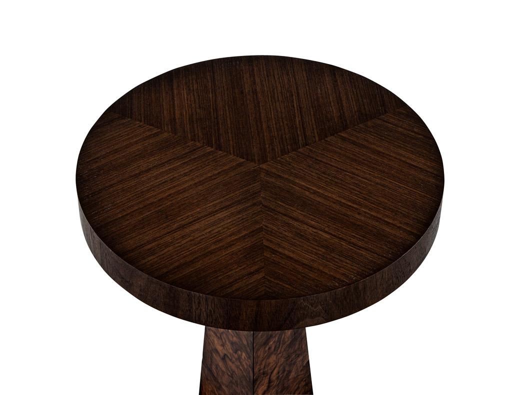 Stunning walnut accent table. Crafted with exquisite attention to detail, this accent table boasts of beautiful walnut wood grains that add warmth and character to any space. The thick round top provides ample surface area for placing drinks,