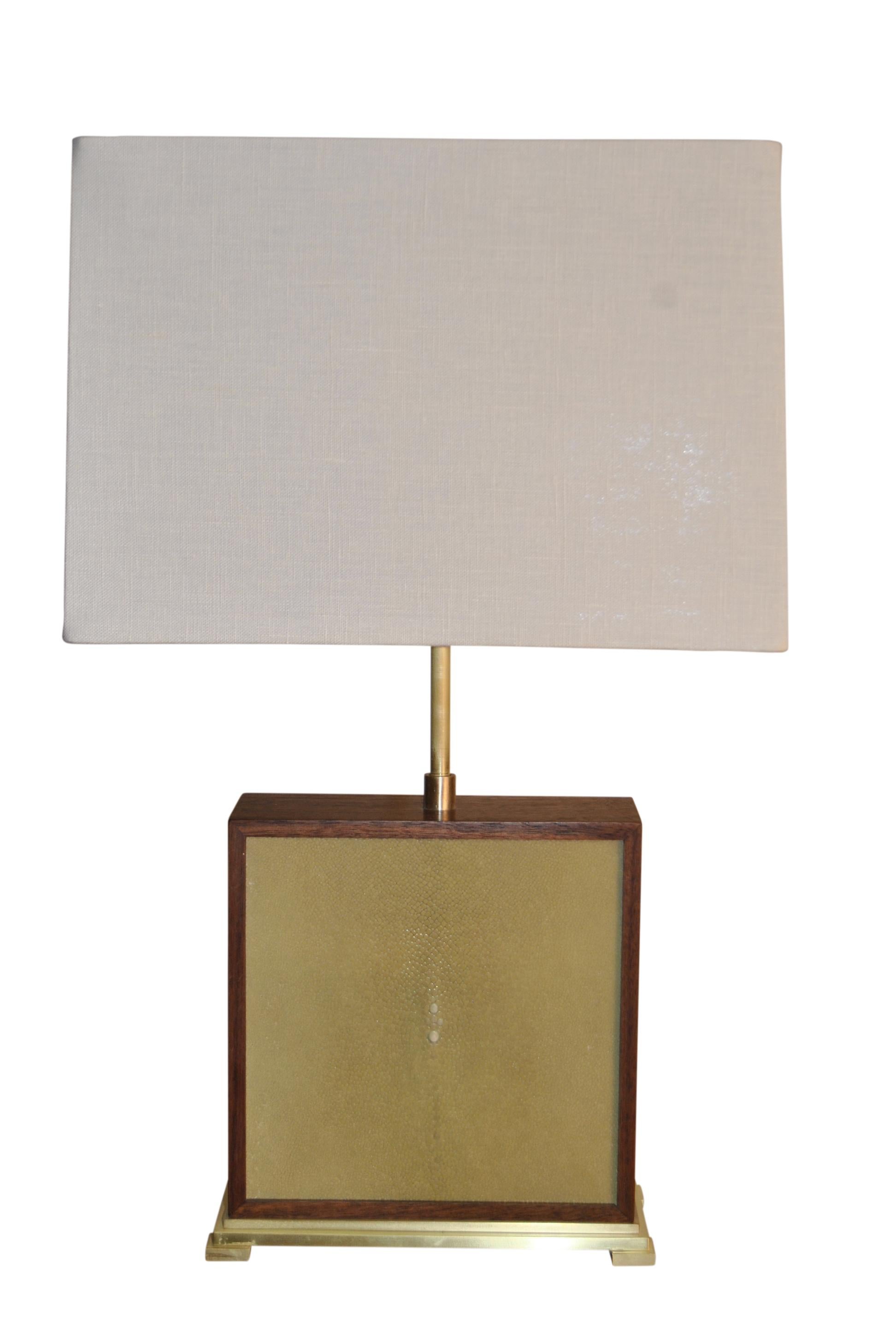 Handcrafted table lamp in walnut, stingray hide and brass polished and lacquered to satin finish. Various color options for stingray are shown in our pictures with colors ranging from neutrals to bright prime colors to deep jewel tones. Minimalistic