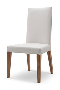 Modern Walnut backed Dining Chair Designed by Greg Sheres.  In Stock.