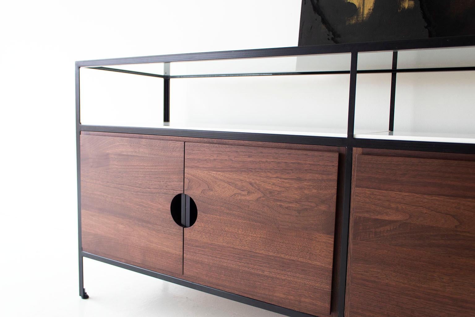 This Modern Walnut Credenza from the Cali Collection is made in the heart of Ohio with locally sourced wood. Each unit is handmade with solid black walnut and finished with a beautiful commercial grade matte finish. The frame is hand welded steel