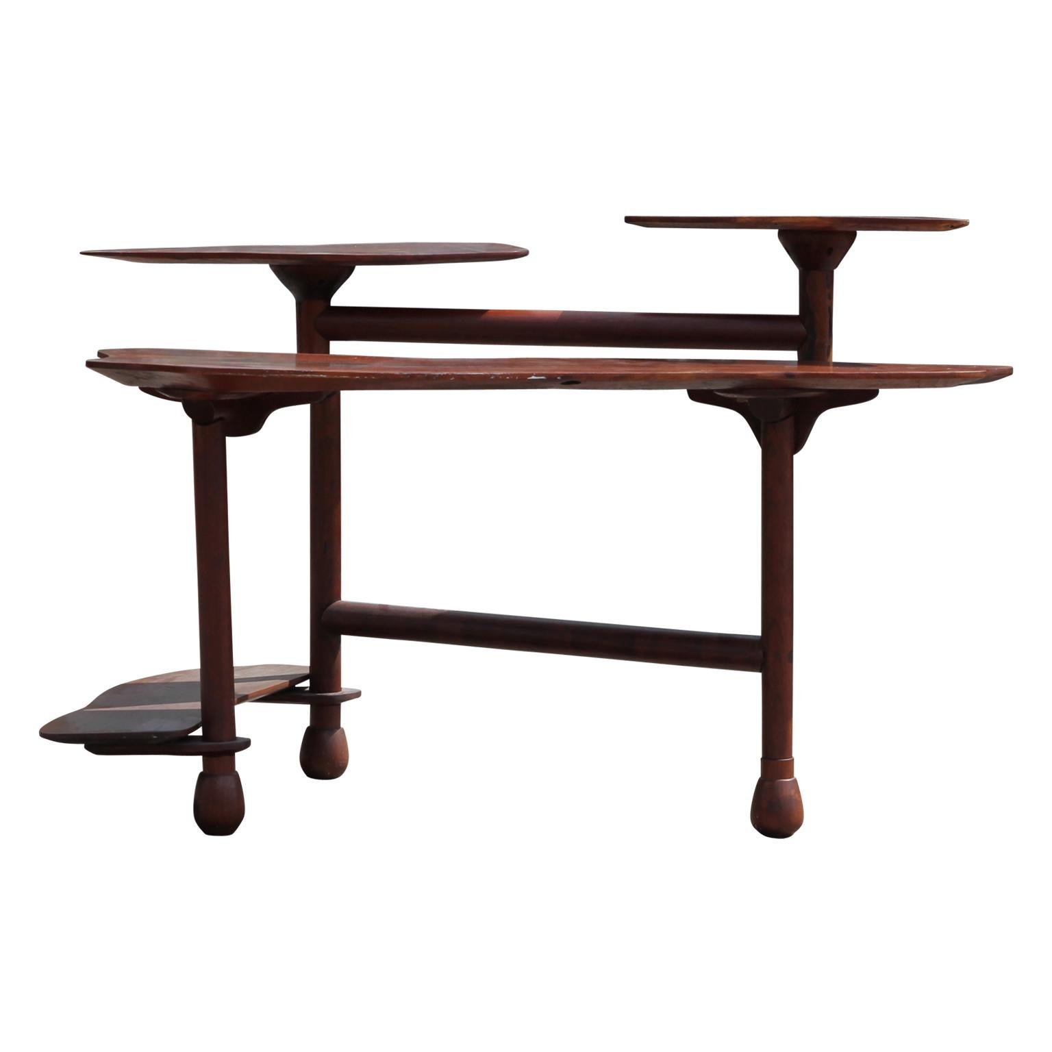 This unique desk brings the flow of nature into your office space. Above the desk there are two floating organically shaped platforms and underneath the desk there is a convenient footrest. The multi-tiered design makes it both functional and