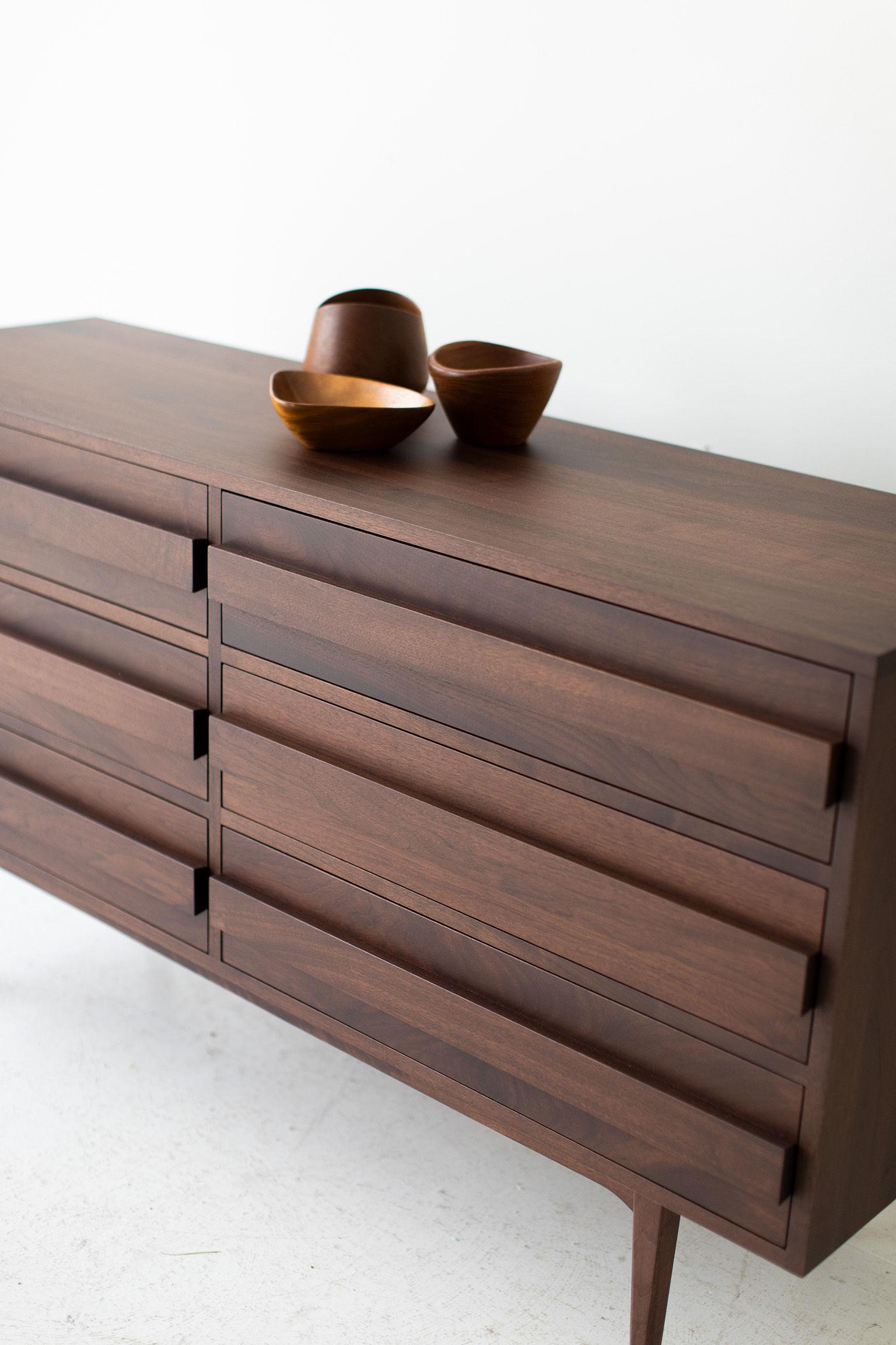 This modern dresser is made in the heart of Ohio with locally sourced wood. Each dresser is hand-made with solid walnut and finished with a beautiful matte commercial grade finish. It is important to us to let the natural beauty of the walnut shine.