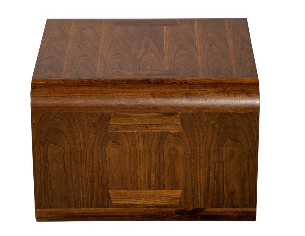 Modern walnut end table with curved design.
Price includes complimentary curb side delivery to the continental USA.