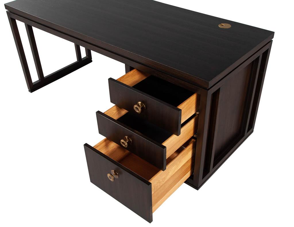 Modern Walnut Office Desk. Beautiful walnut wood grain patterns highlighted in a rich dark espresso finish color. Circular antiqued brass hardware and matching gromets complete the look. Features 2 grommets as well as hidden back door compartment