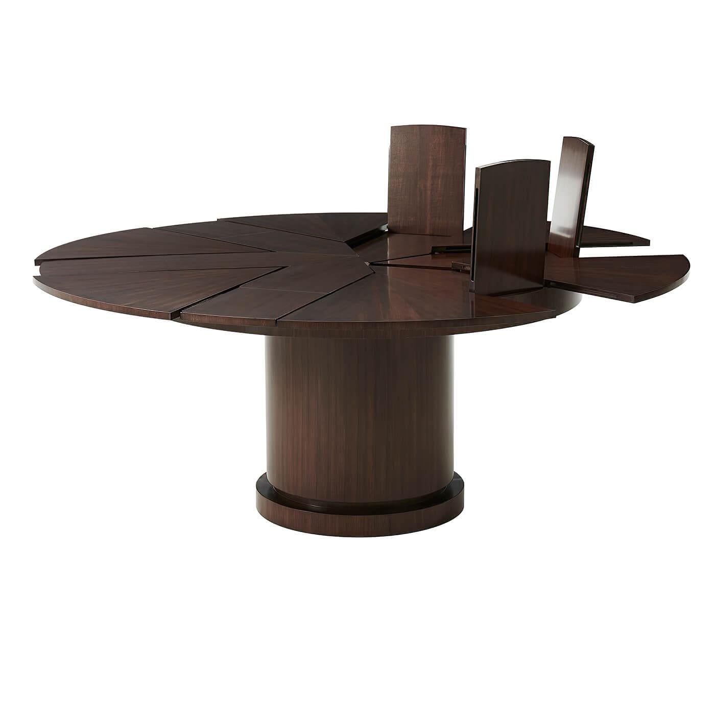A Mid-Century Modern style round pacific walnut extension dining table with self-storing fold-out leaves on a bold cylindrical column pedestal base.

Dimensions:
Open: 72