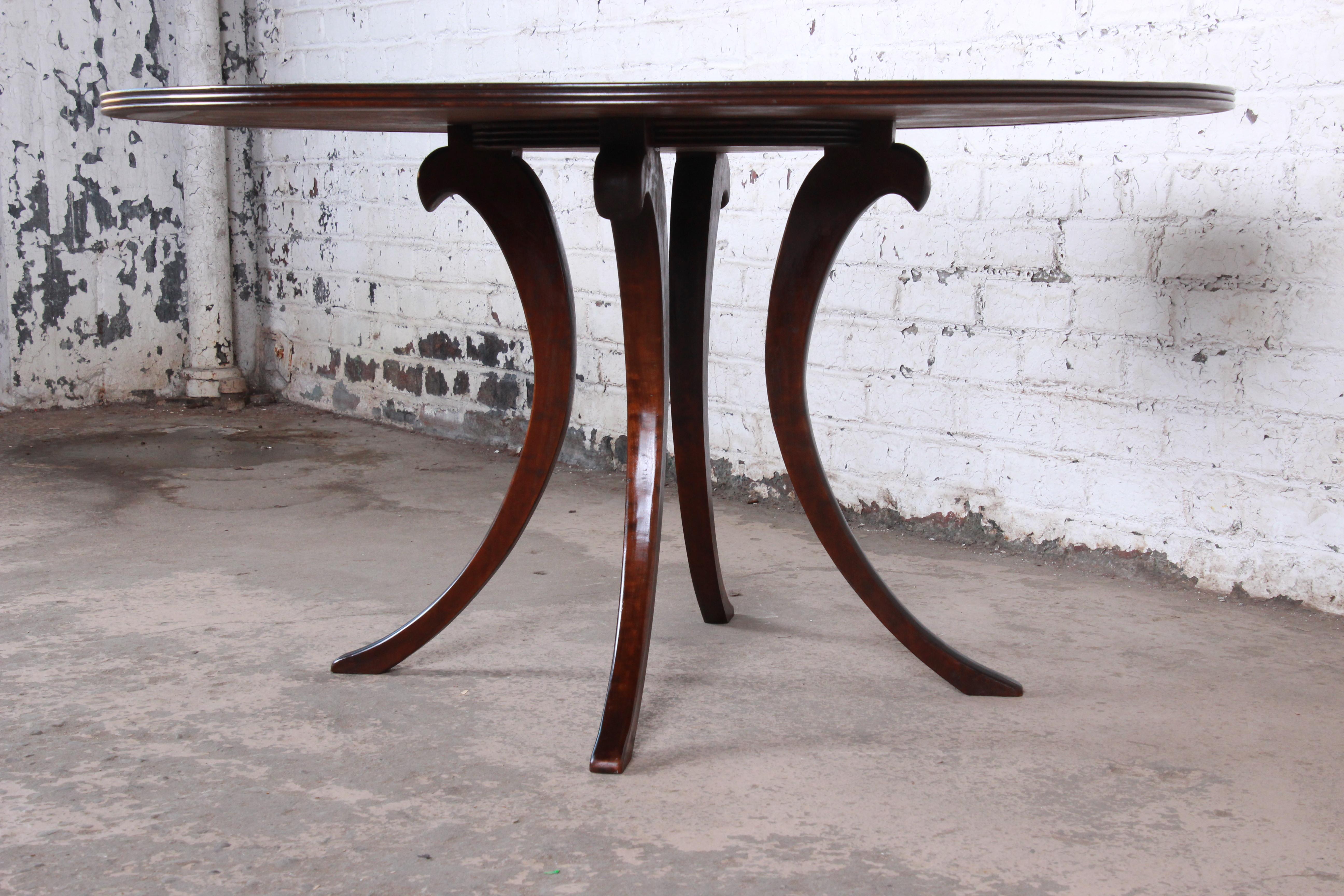 20th Century Modern Walnut Saber Leg Dining Table with Inlaid Starburst Parquetry Top
