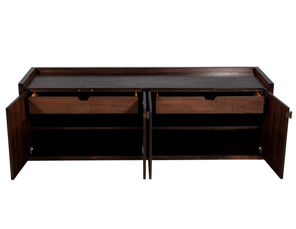 Modern walnut sideboard buffet with marquetry inlay. This stunning cabinet with its understated elegance and timeless design is surely too please. Made of fine matched walnut with unique modern marquetry patterns, finished by Carrocel in a warm