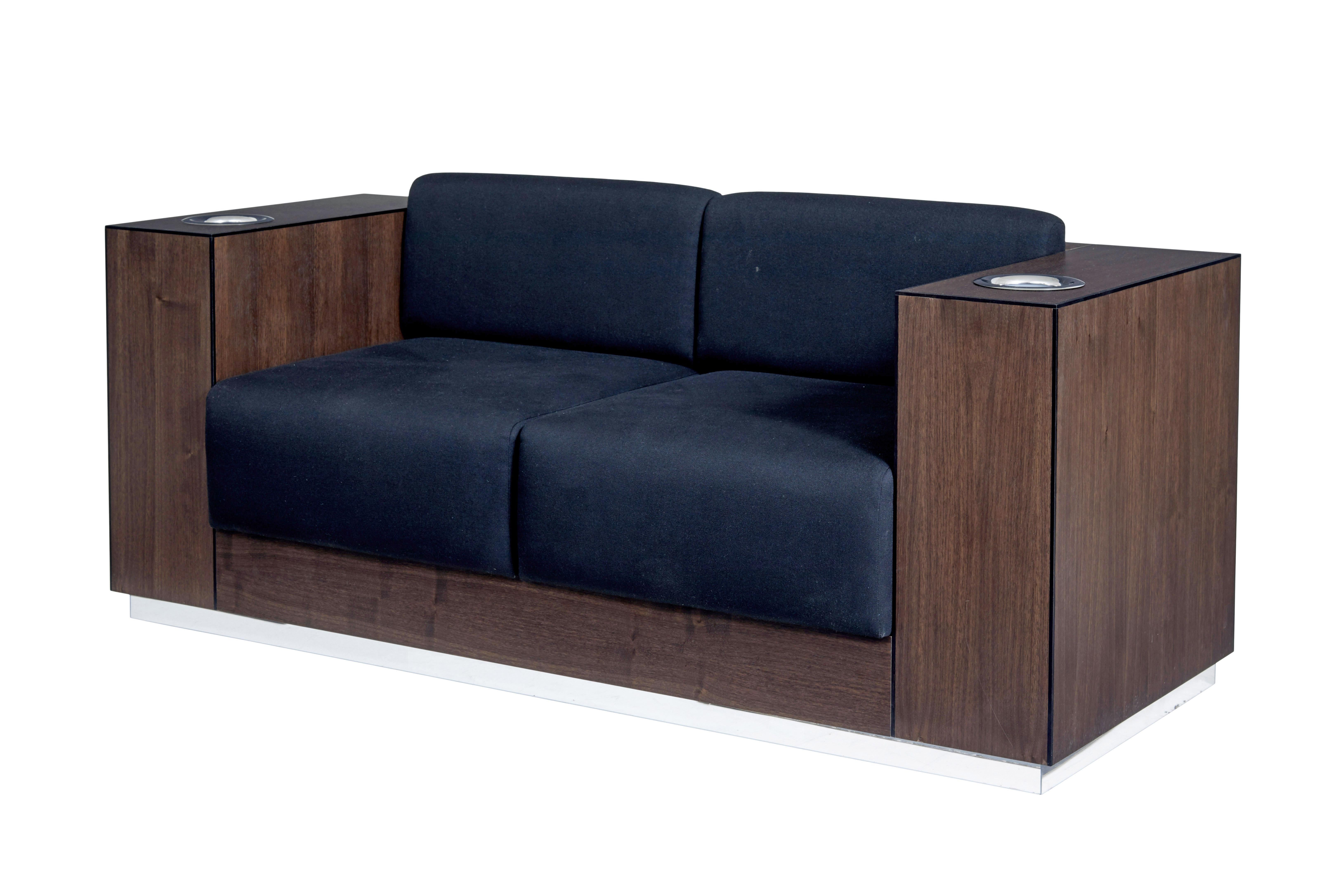 Modern walnut sofa fitted with kaelo wine coolers.

We are please to offer this unique bespoke made sofa which features a kaelo wine cooler in each arm.  This piece was made for an exhibition on the kaelo trade stand to showpiece their design, so