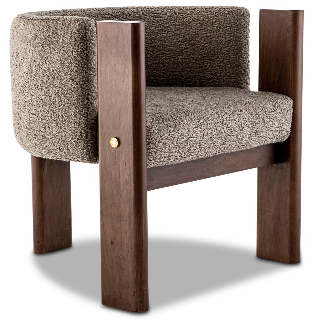 The Modern Malta dining room chair designed by Egg Designs and manufactured in South Africa works equally well as a dining, lounge or side chair.
It has a solid construction with old school jointing. The frame is solid Walnut timber with solid brass