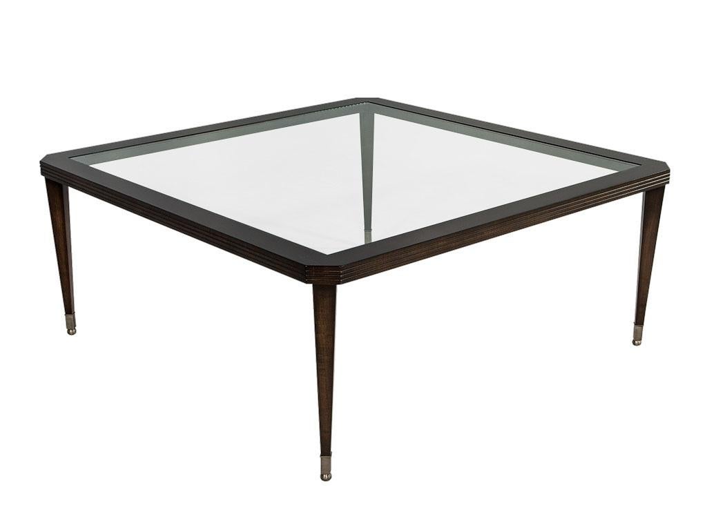 Transitional large square cocktail table. Walnut fluted edge frame custom finished in dark espresso, glass inset top and brushed stainless steel caps on slightly tapered legs.

Price includes complimentary curb side delivery to the continental USA.