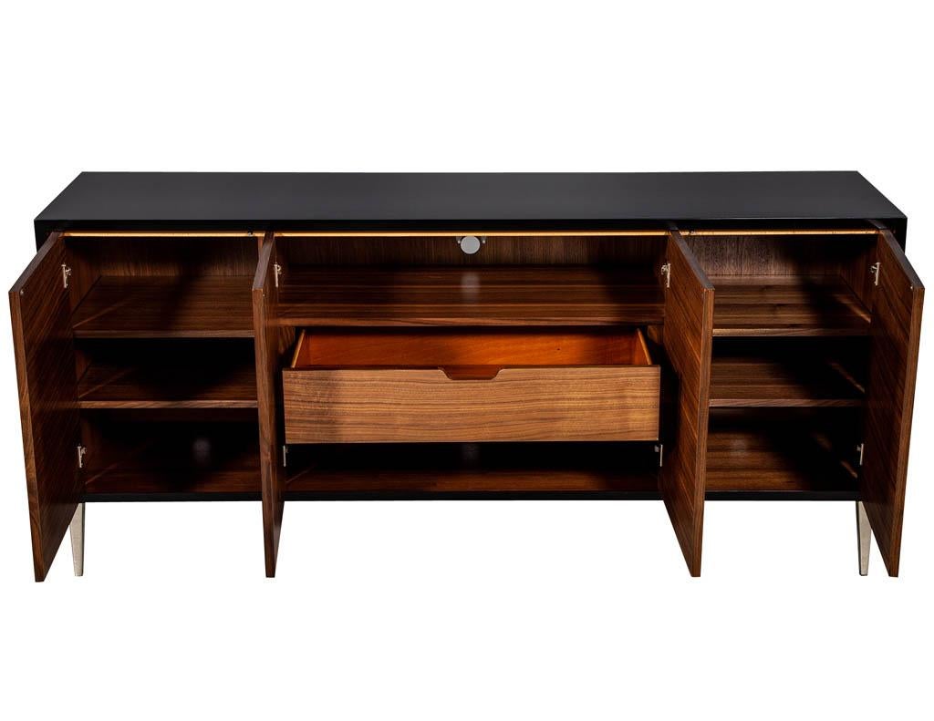 Modern walnut sunburst sideboard buffet credenza. Stunning walnut sunburst patterned door fronts with an ebonized case atop polished nickel legs.

Price includes complimentary scheduled curb side delivery service to the continental USA.