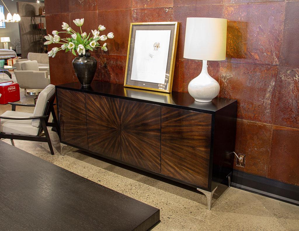 Modern Walnut Sunburst Sideboard Credenza. Featuring stunning walnut sunburst front with incredible detailed pattern, finished in a warm dark walnut tone. The exterior of the cabinet is finished in a hand polished black lacquer. Completed with sleek