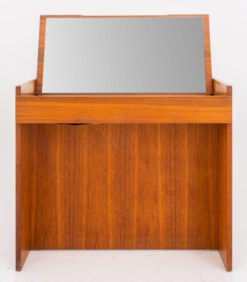 Mid-Century Modern walnut vanity table or maquilleuse, 1970s, the rectangular top lifting to reveal a mirrored underside and bi-level white-veneered trays. Measures: 26.5