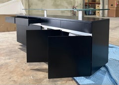 Modern Wenge buffet with floating glass top designed by Greg Sheres.  In stock.