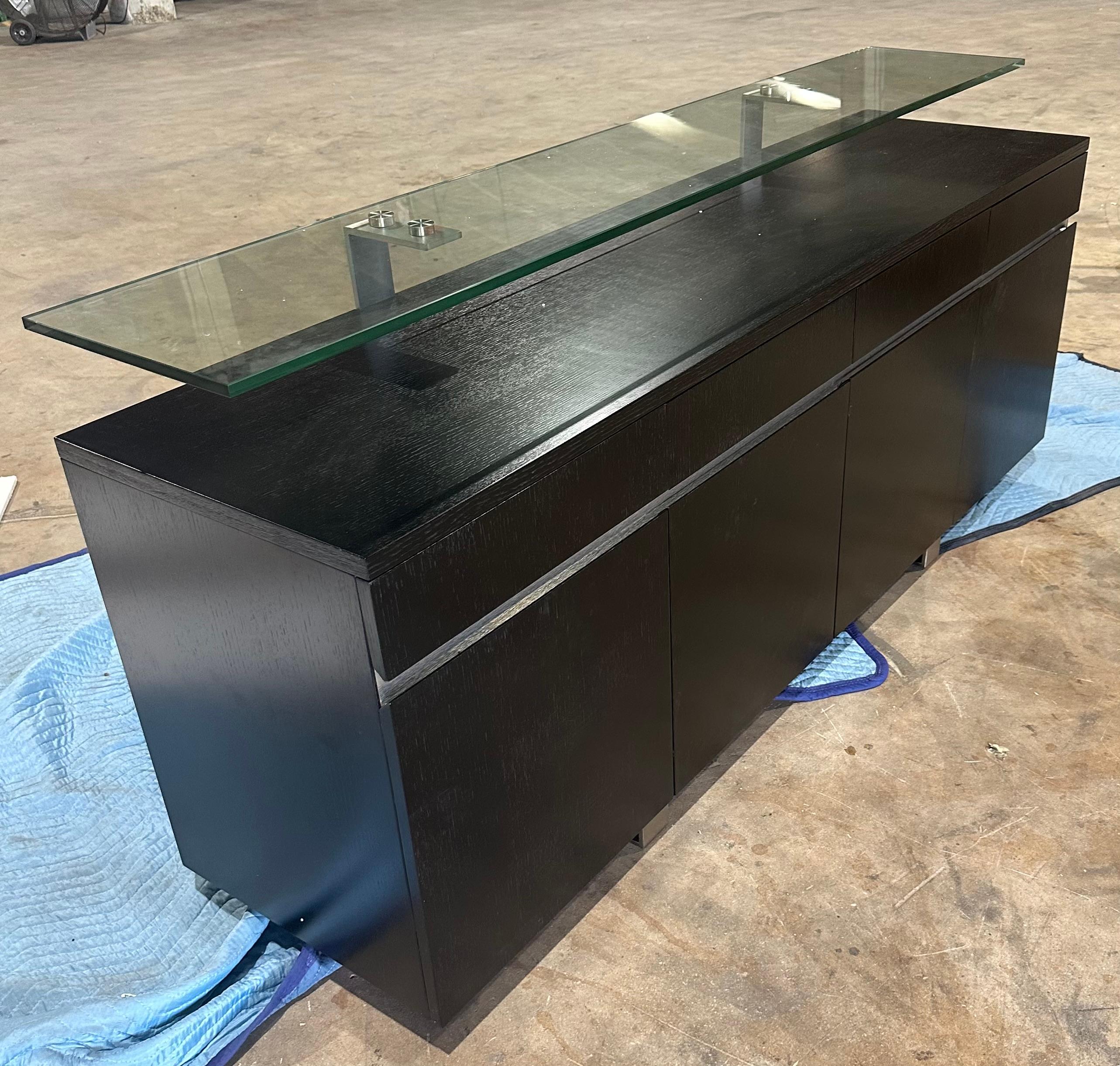 Chinese Modern Wenge buffet with floating glass top designed by Greg Sheres.  In stock. For Sale