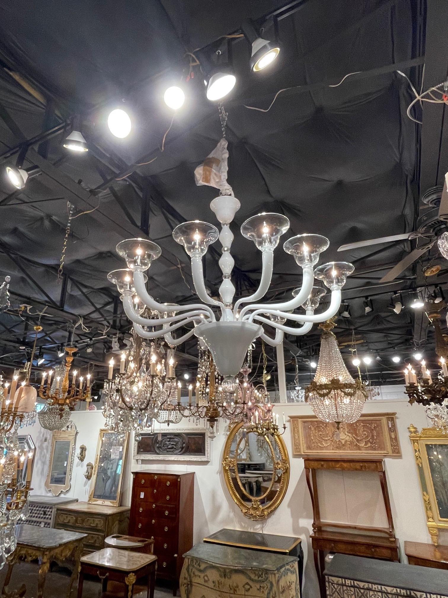 Stylish modern white and clear Murano glass chandelier with 12 arms. A very impressive and beautiful chandelier that makes a huge impact!