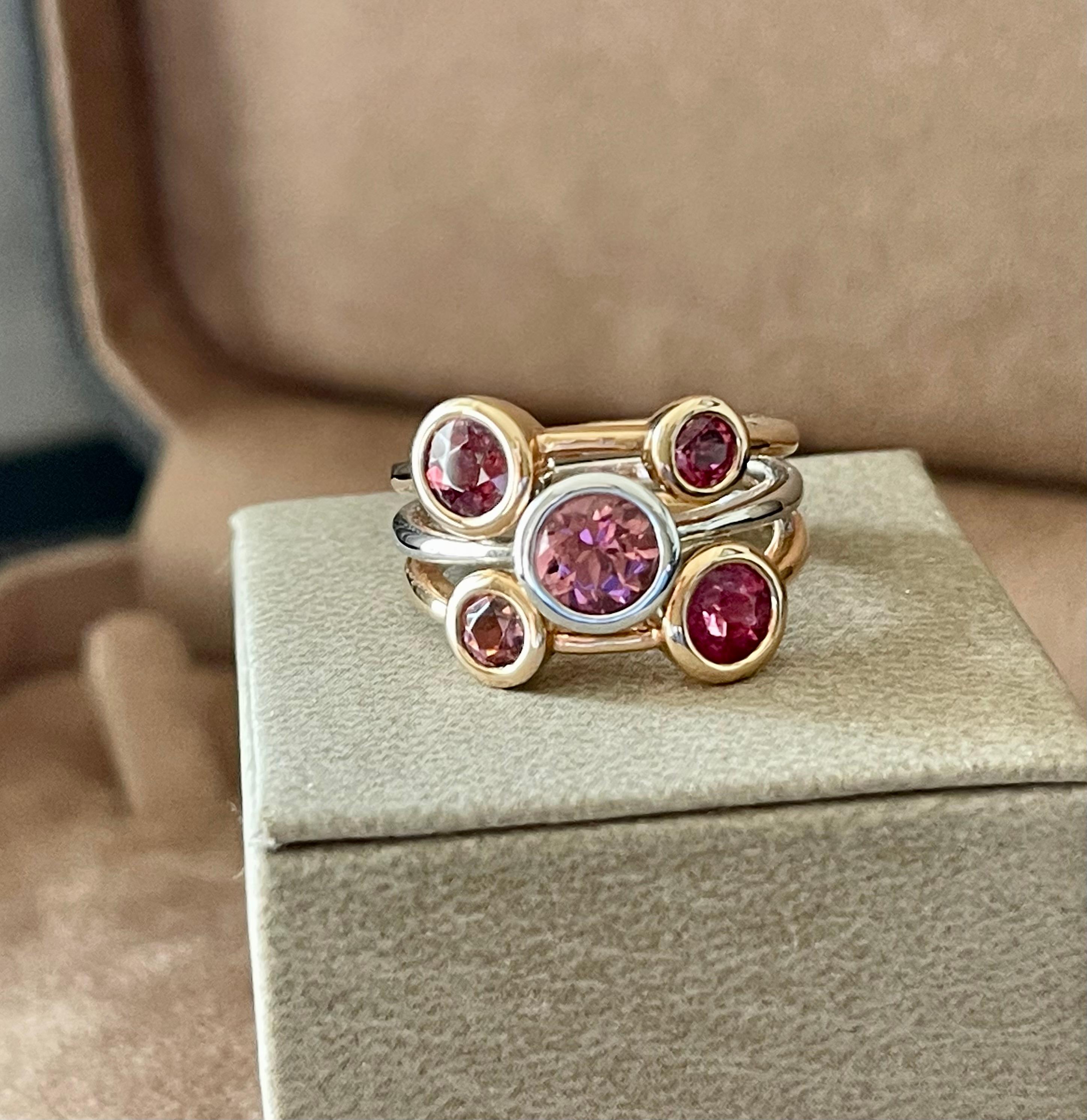 Unusual and modern 18 K white and rose Gold Ring featuring 5 pink Tourmalines with a total weight of 2.35 ct. 
The ring is currently size 55/15 ( american Ring size 7.5) but can be resized to a certain extent. 
QUESTIONS?  Contact us right away if