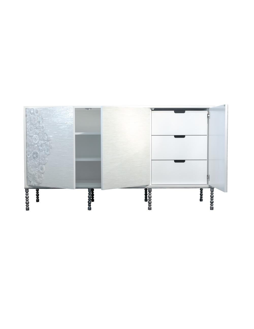 This piece is very special because it is a great storage, functional pieces.
with 3 doors touch latch, it has a set of interior shelving that makes it perfect to use it in the bedroom as a chest, or dining room.
the exterior blossom work is all