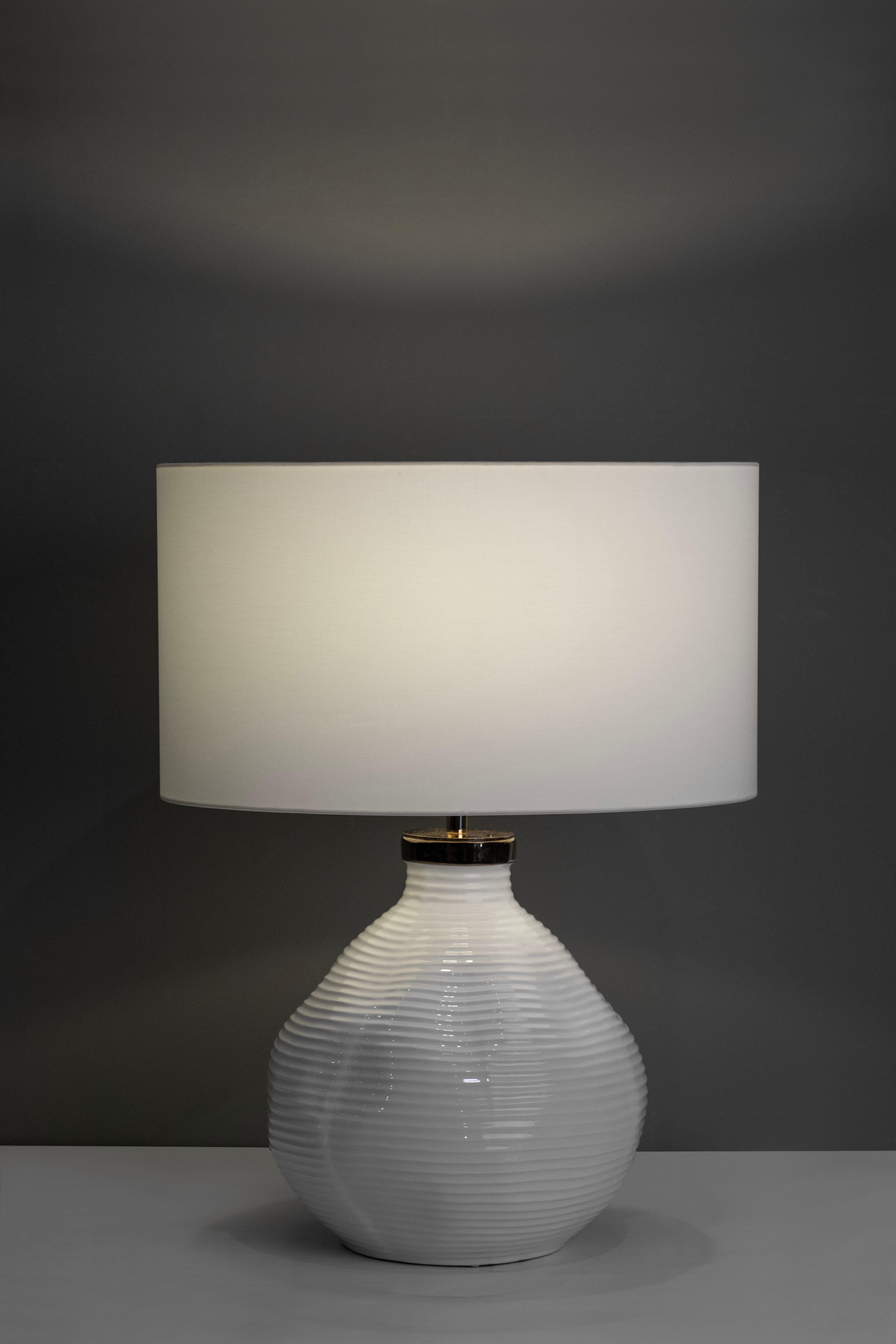 Candeias Table Lamp, Modern Collection, Handcrafted in Portugal - Europe by GF Modern.

The Candeias table lamp creates a subliminal ambience for extraordinary living. The base in white glazed ceramic with a gold detail on top harmonizes seamlessly