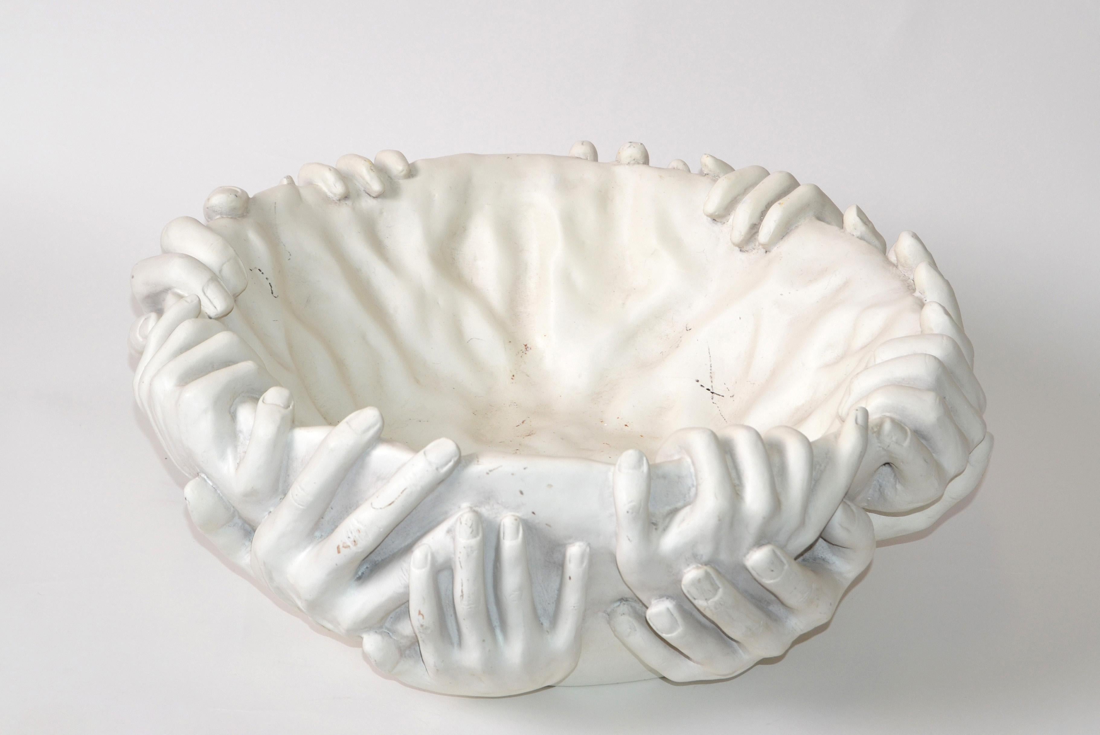 Modern figurative surreal sculptural bowl in the style of the Italian Artist Fornasetti.
The 'Very Handy Bowl Indeed' is handmade of an off-white ceramic resin composite.
This hand bowl combines beauty and practicality as it portrays multiple