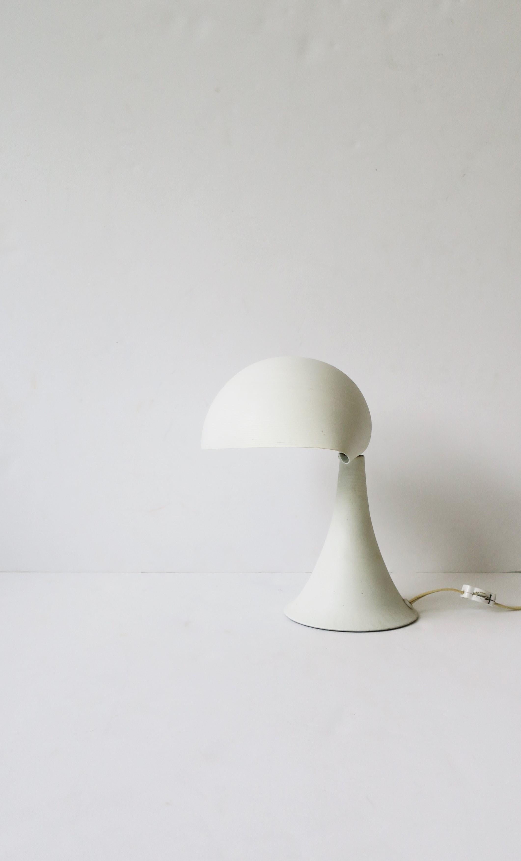 A beautiful modern or Midcentury Modern period white desk or table lamp, circa mid-20th century, 1960s. Lamp is aluminum with matte white surface. A great lamp for an office desk or nightstand table, etc. Two-way switch on cord close to back of lamp