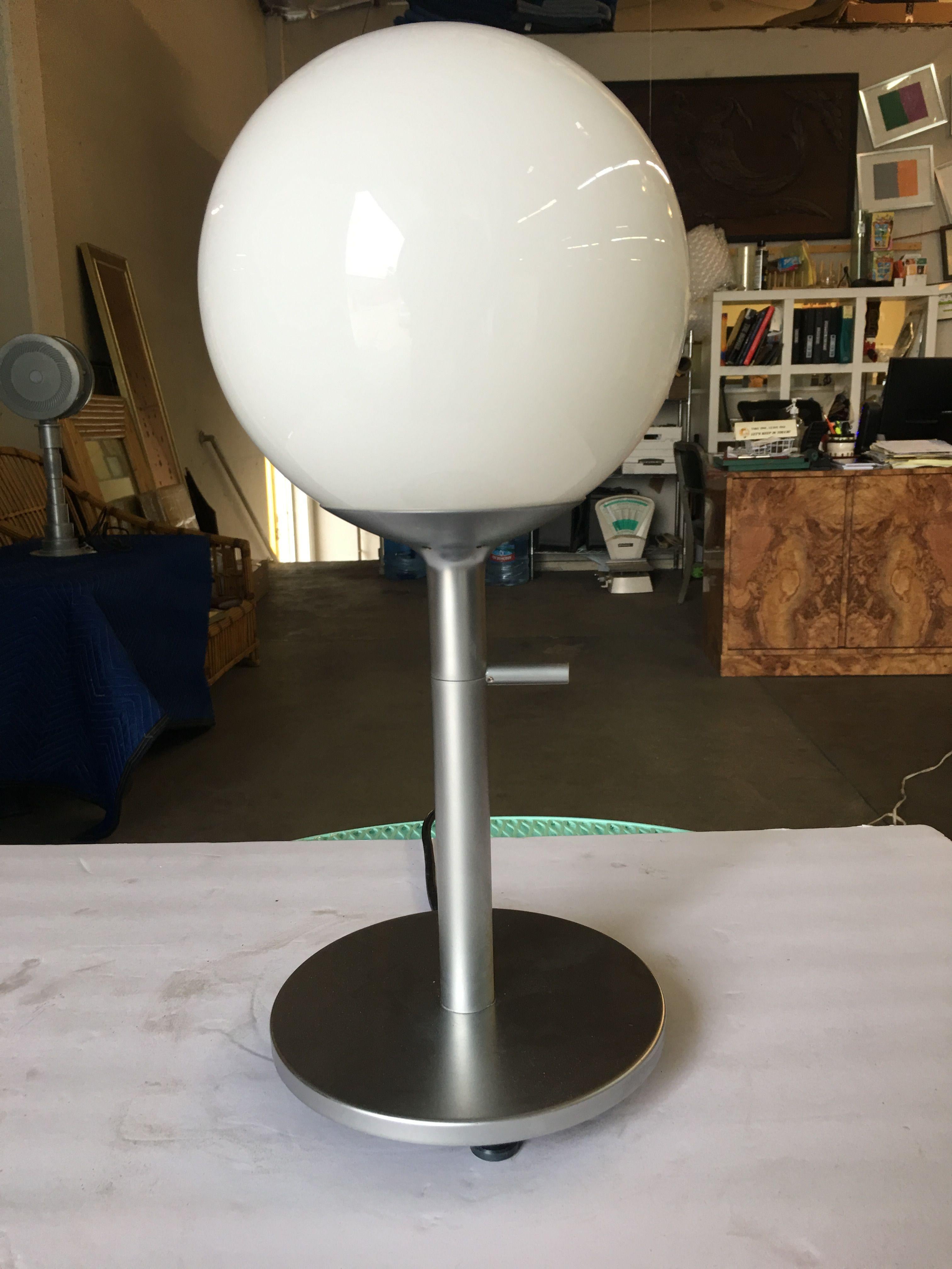 Modern white globe lamp with Satin Chrome Finish steel base.

Available- 3