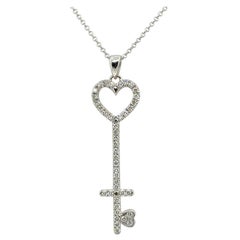 Modern White Gold 0.75 CARAT Natural Round Brilliant Diamond Key Shaped Pendant