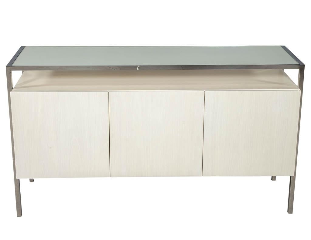 Modern white lacquered sideboard console stainless steel. Featuring stainless steel frame and back painted top glass.
Price includes complimentary curb side delivery to the continental USA.