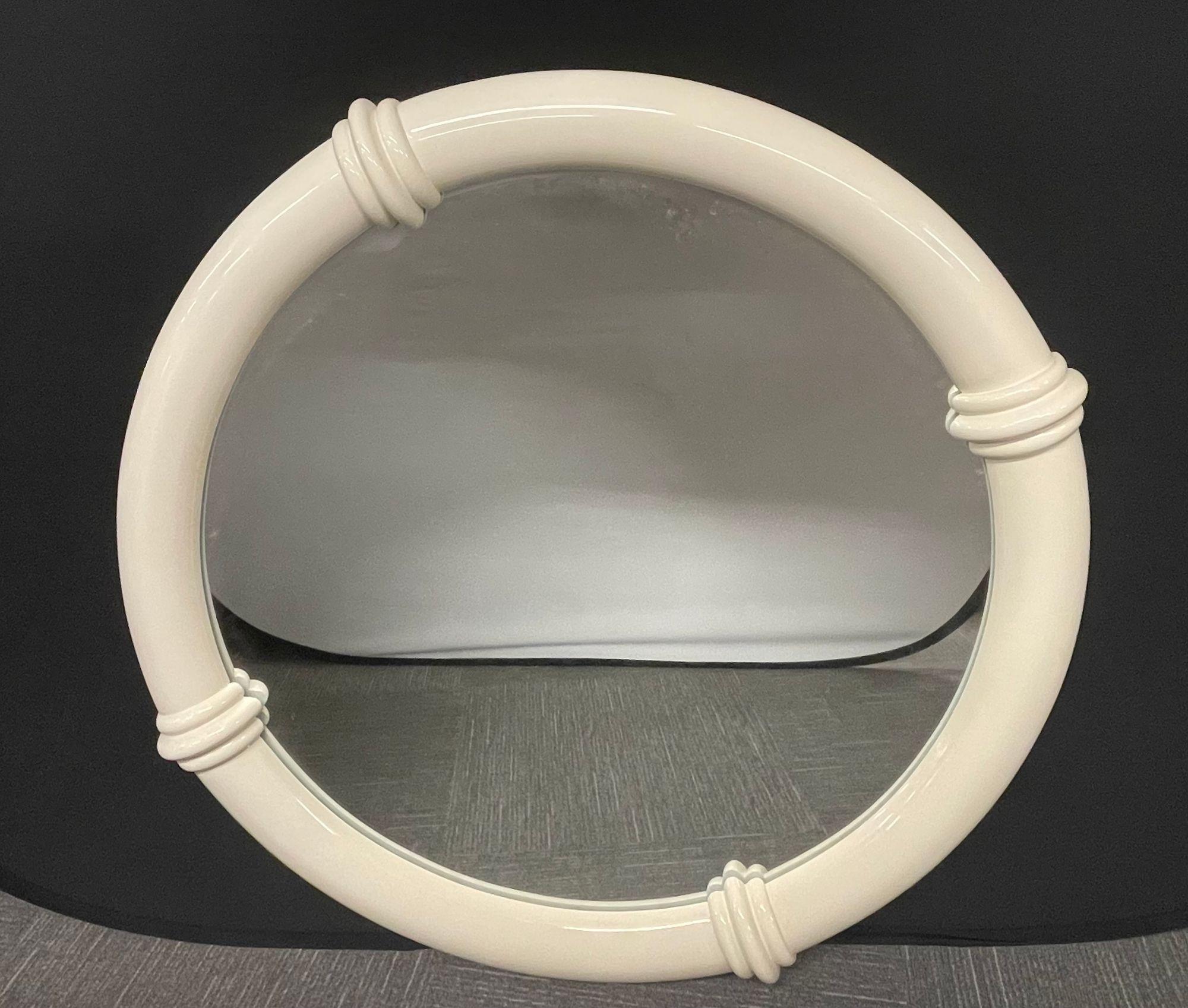 Modern white lacquered wall or console mirror, Mid-Century Modern style. 

In the manner of Karl Springer. The frame of circular design with four tubular sections. 

Diameter 44.5 inches.
3 Deep
 
 
ZlSX.