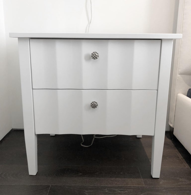 Beautiful set of white nightstands with a scalloped detail on front drawers and sides finished in a semi-gloss lacquered finish, they are in great condition and ready to be displayed.

Measurements:
27