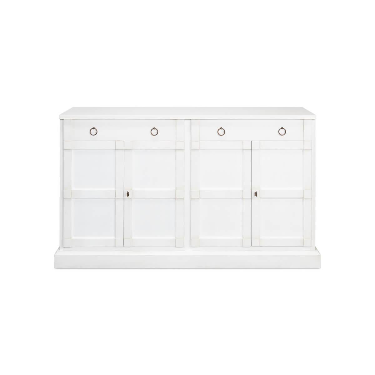 Dressed in Cortina white, it features a clean, linear silhouette that brings an airy spaciousness to any room. The paneled doors are framed by subtle accents.

With two frieze drawers and two cupboard doors that open to interior shelves, the
