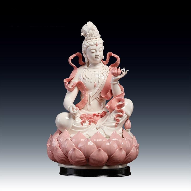 The white porcelain statue of a sitting Buddha in pink and holding a lotus flower is a striking piece that combines artistry with profound spiritual symbolism.

This white porcelain buddha from renowned Chinese kilns in Dehua city which is prized