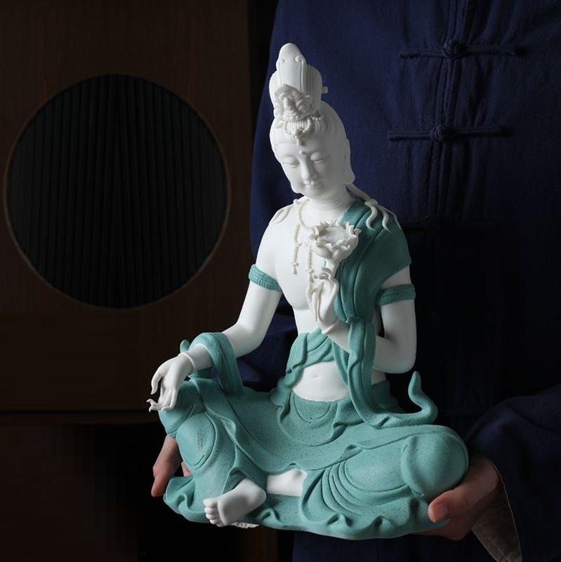 Modern White Porcelain Sitting Buddha in Blue Robe Holding a Lotus Flower For Sale 2