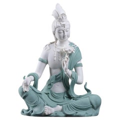 Modern White Porcelain Sitting Buddha in Blue Robe Holding a Lotus Flower