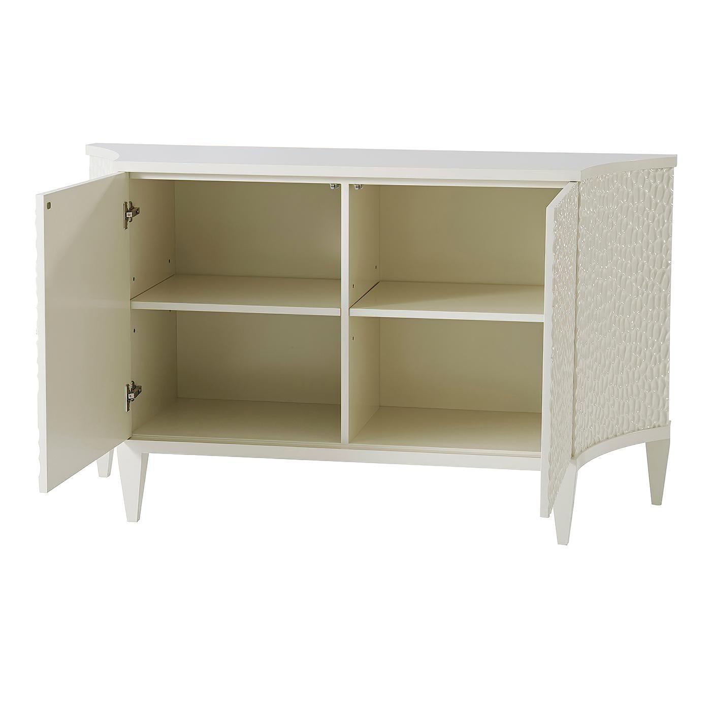 Modern white chip carved door cabinet with two section interior with an adjustable shelf to each section.
Dimensions: 60