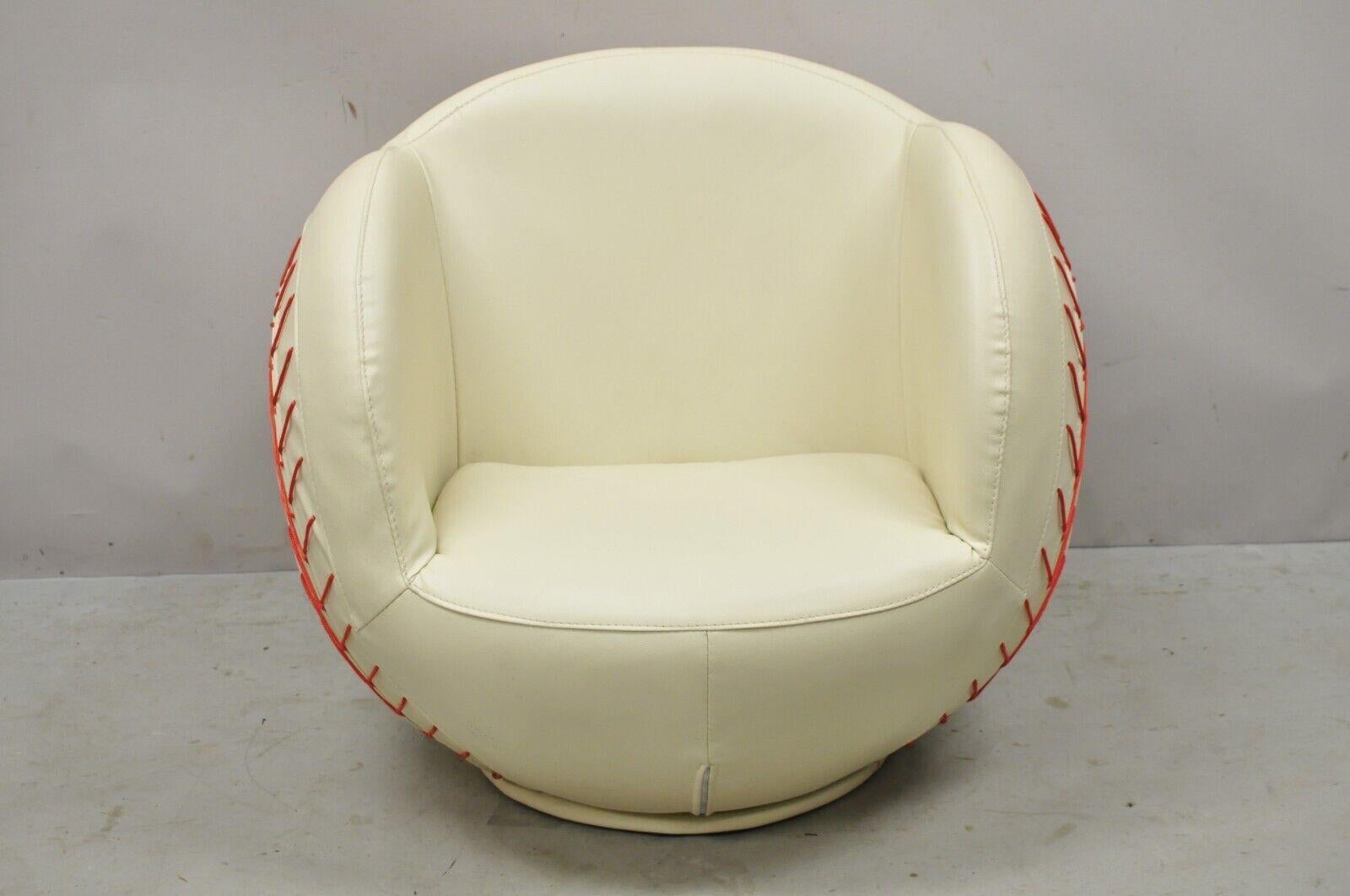 Modern white Vinyl baseball swivel lounge chair for child's room. Item features a revolving base, vinyl upholstery, sleek sculptural form, nice for child's room, circa 21st century. Measurements: 26