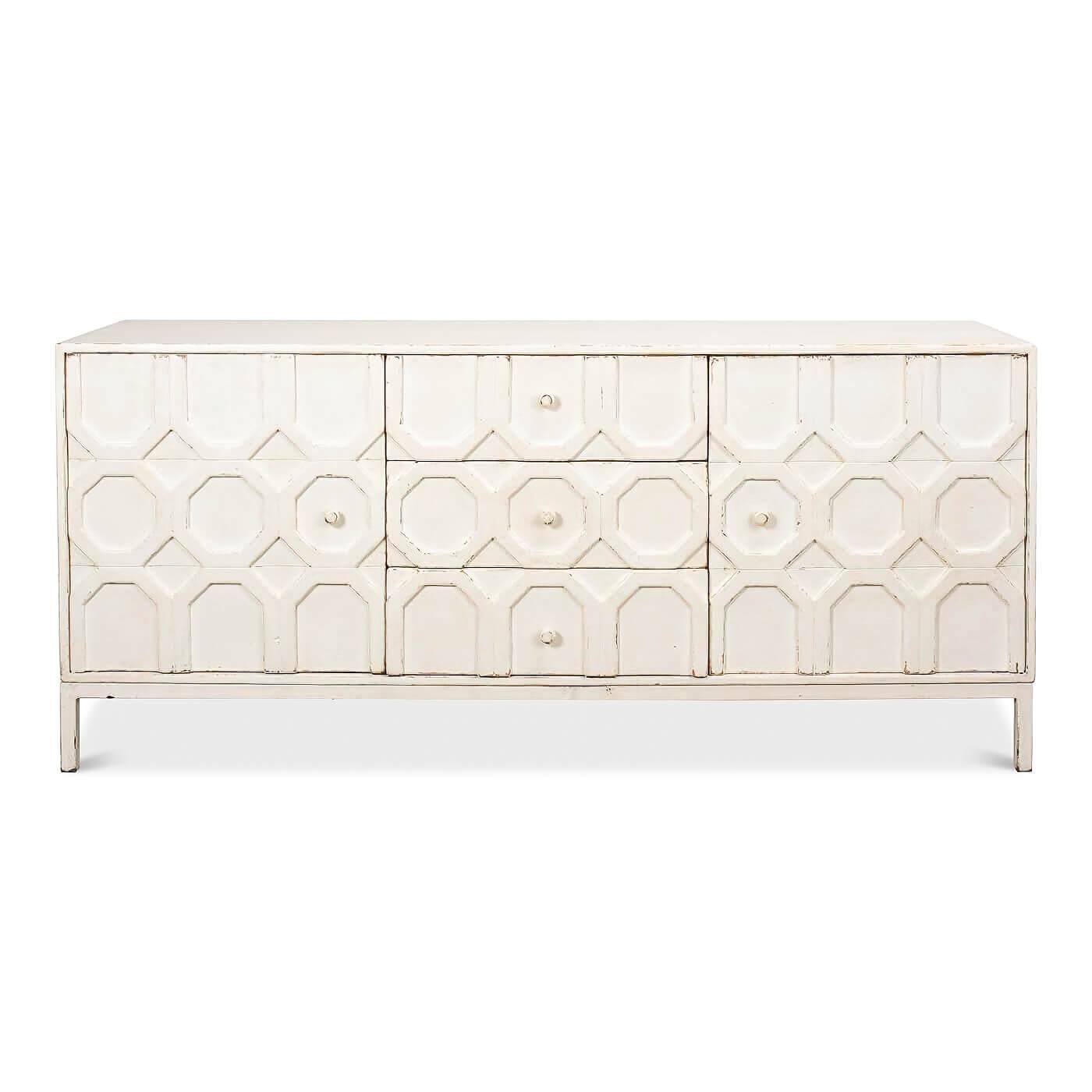 A modern geometric sideboard. This front has a unique applique design with patterns of octagons running down the center. It has two doors and a bank of three drawers in the center. 

This beautiful piece is crafted in pine and has a