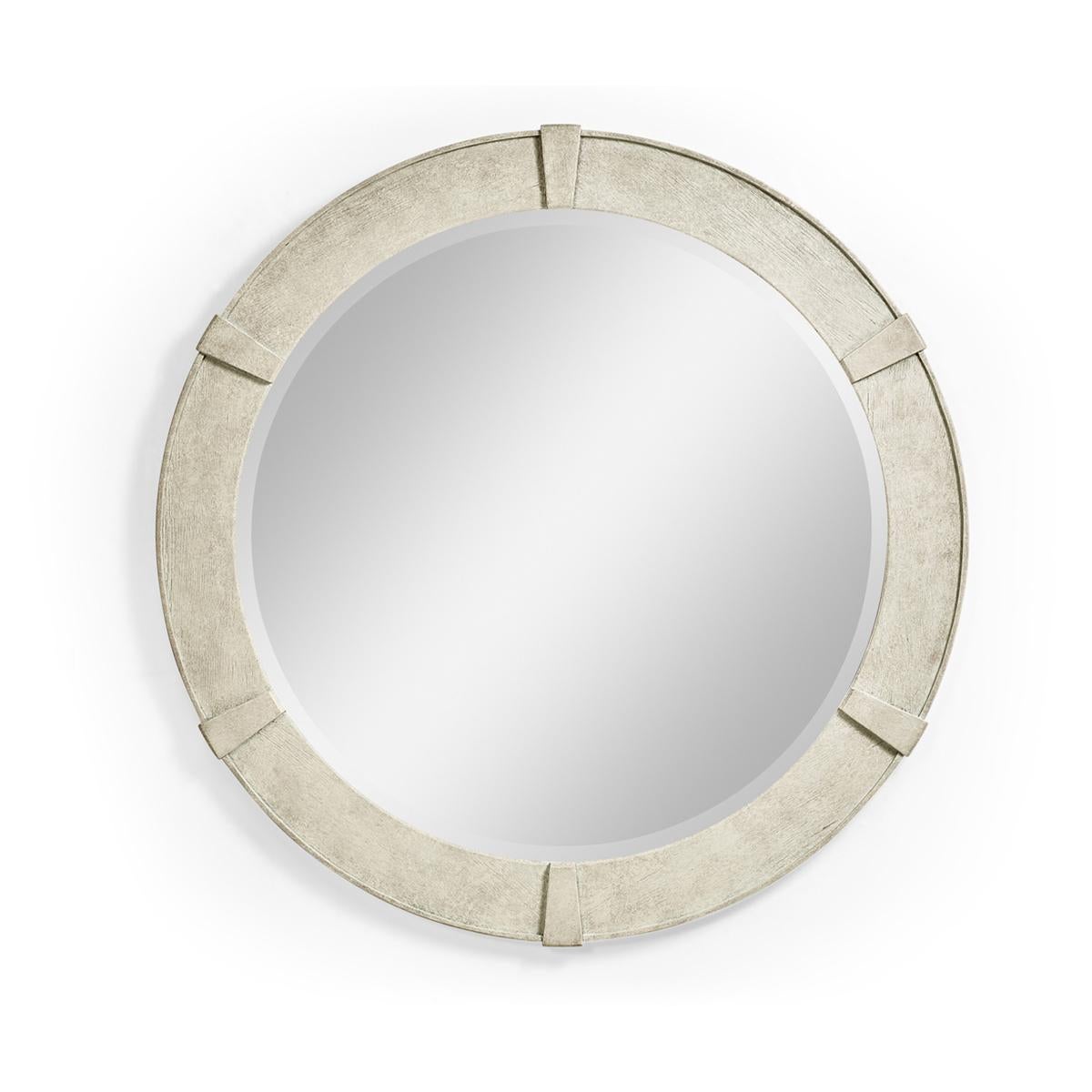 Modern Whitewash round mirror, the small circular mirror in a whitewash driftwood finish with contemporary relief carved detail and a plain beveled mirror glass.

Dimensions: 35 7/8