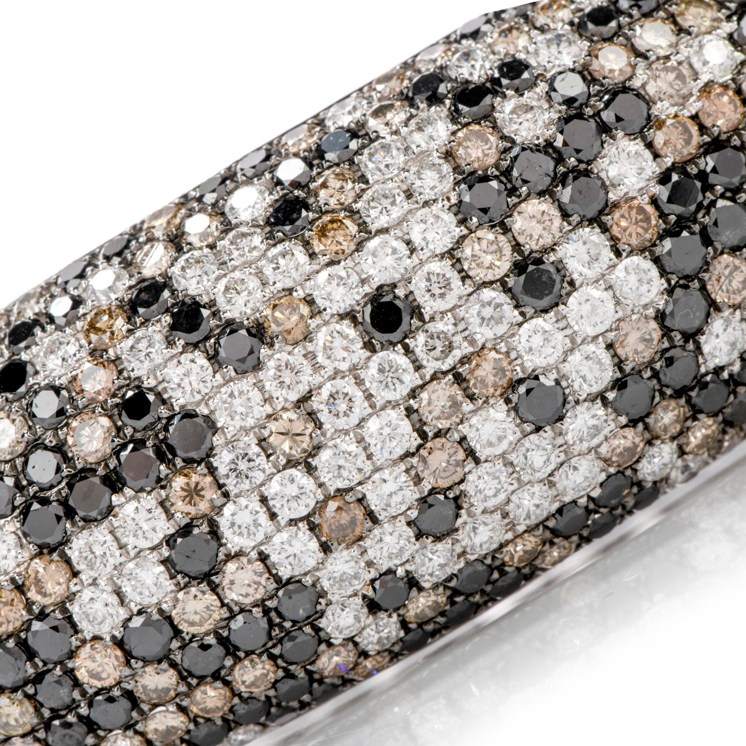 This scrumptious and delightfully tasteful twist on 

a classic bangle bracelet features bold colors of metal and diamonds.

Black, White and Champagne colored diamonds, in a random pattern, are the focal point

of this exquisite 18K gold