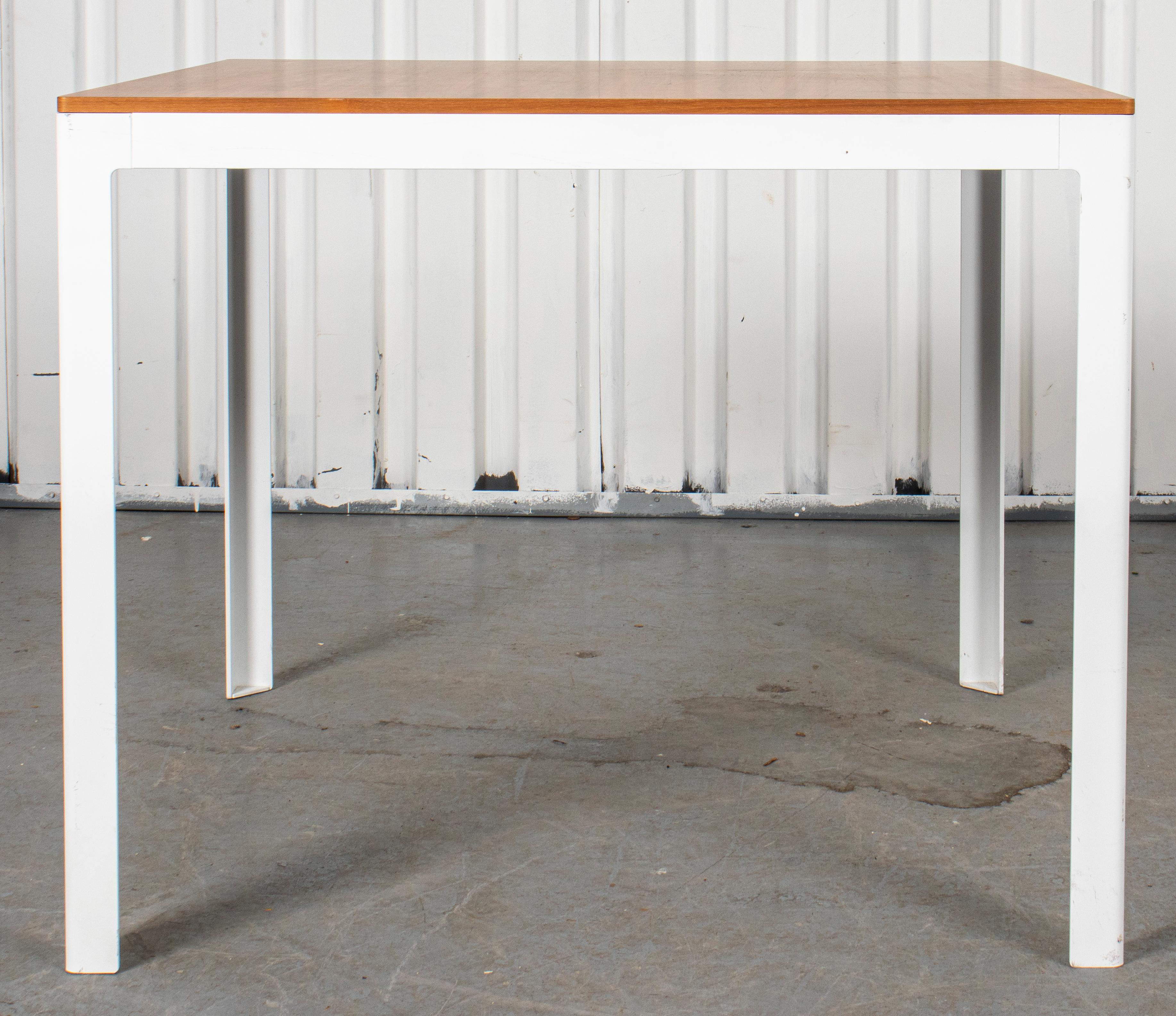 Modern wood table with white enameled steel base.

Dimensions: 28.5” H x 34.75” W x 34.75” D.



Dealer: S138XX.