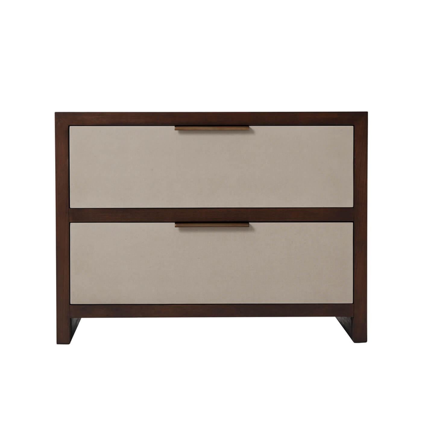 Modern wood and leather two-drawer nightstand in a cherry veneer with almond finish. This nightstand has two singular grey leather-wrapped drawers accented with brushed pyrite finish handles. 

Dimensions: 29.5