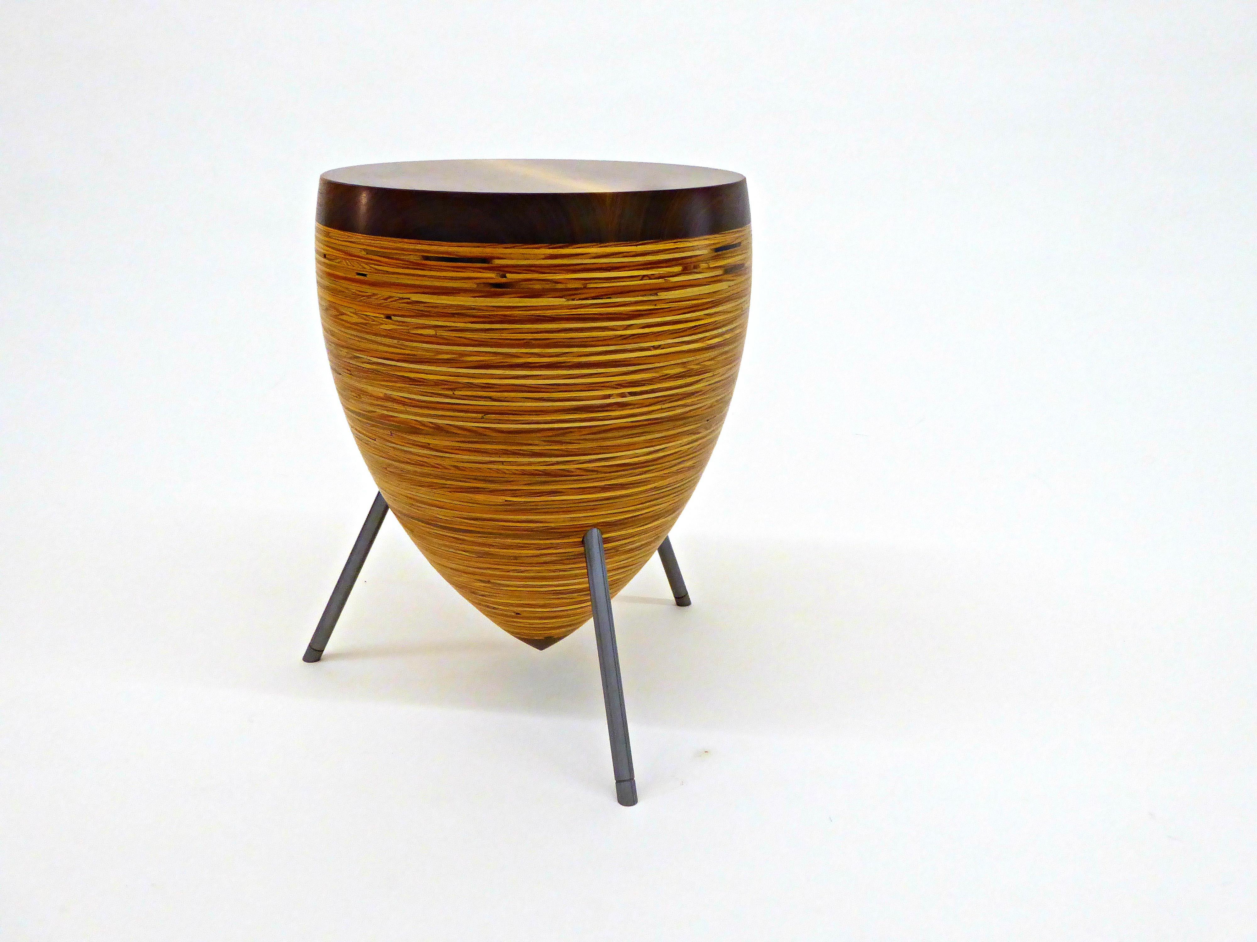 Drum stool/table

A Poux signature design, the Drum stool/table collection is a perfect marriage of material, sculpture and precision. The solid wood top is seamlessly connected to a funnel of layered plywood rings and shaped on a lathe. After