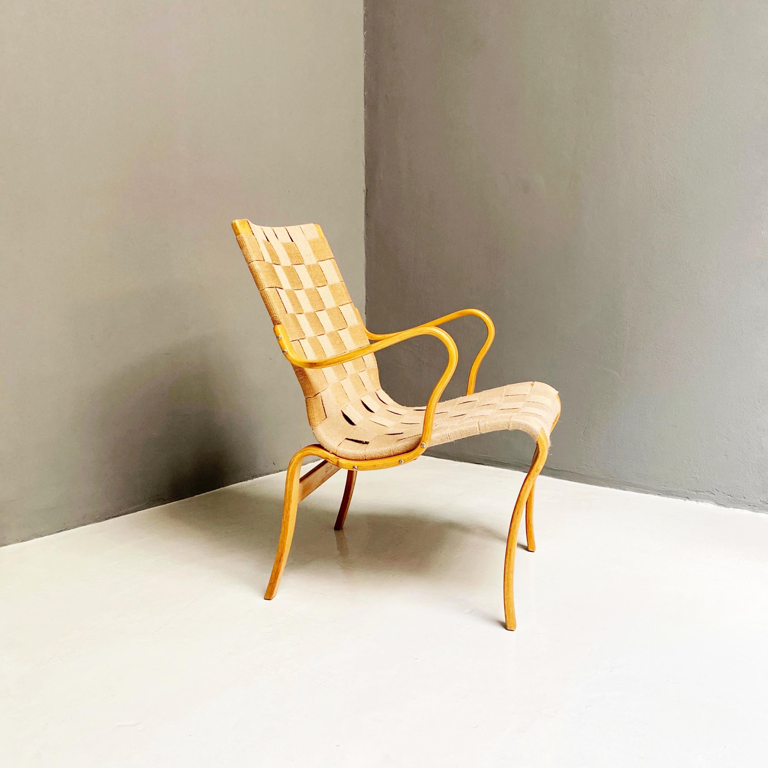 Eva chair by Bruno Mathsson for Firma Karl Mathsson, 1977
Eva chair with armrests in birch wood with curved structure and seat with woven fabric. Designed by Bruno Mathsson for Firma Karl Mathsson. Designed 1970 to 1979.

Excellent condition,