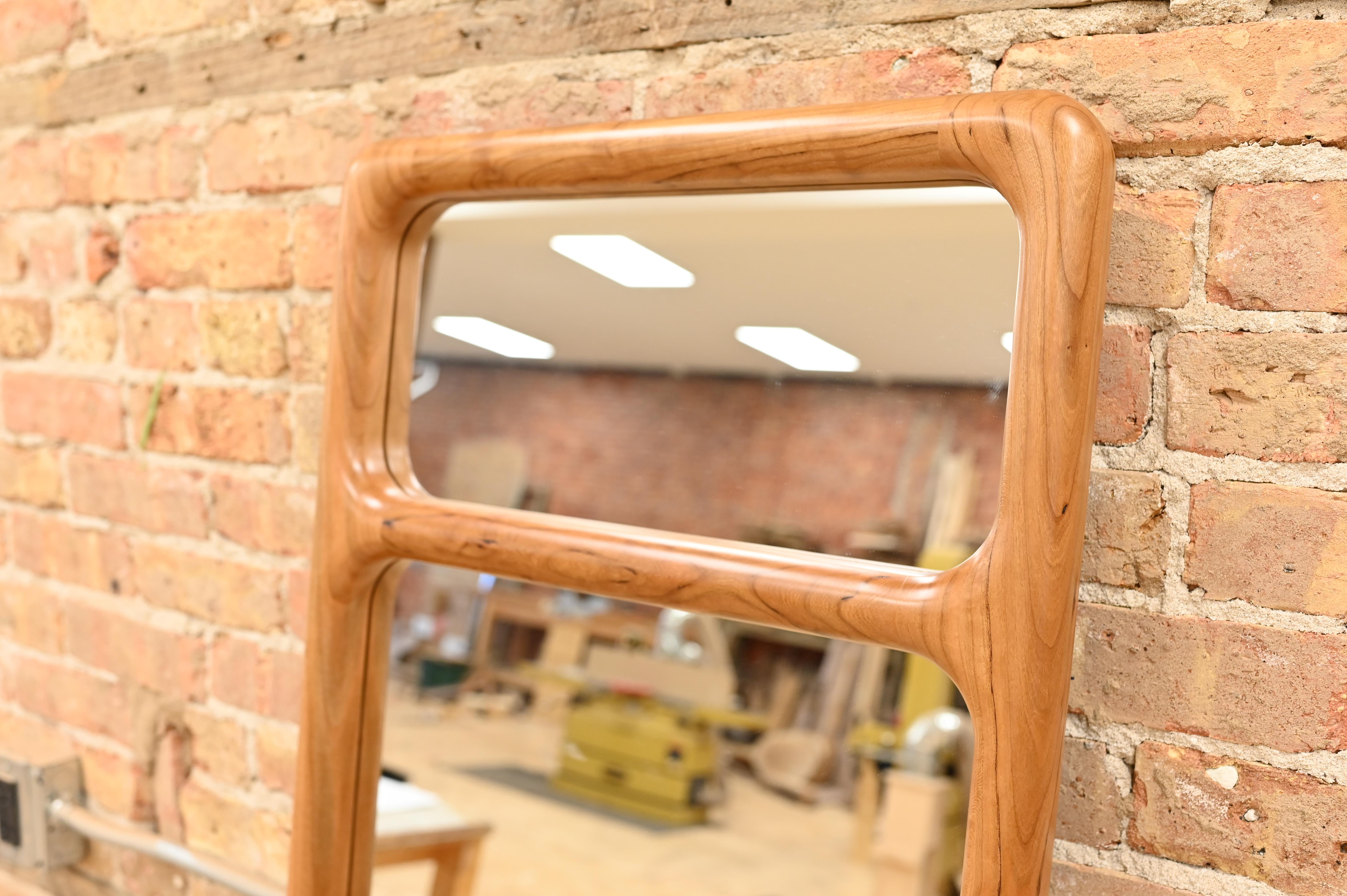 Handcrafted from solid wood, this mirror is a modern statement piece that is perfect for apartment living. It’s beautiful aesthetics and useful design allow it to be used as a standing mirror, a vertically hanging mirror, or a horizontally hanging