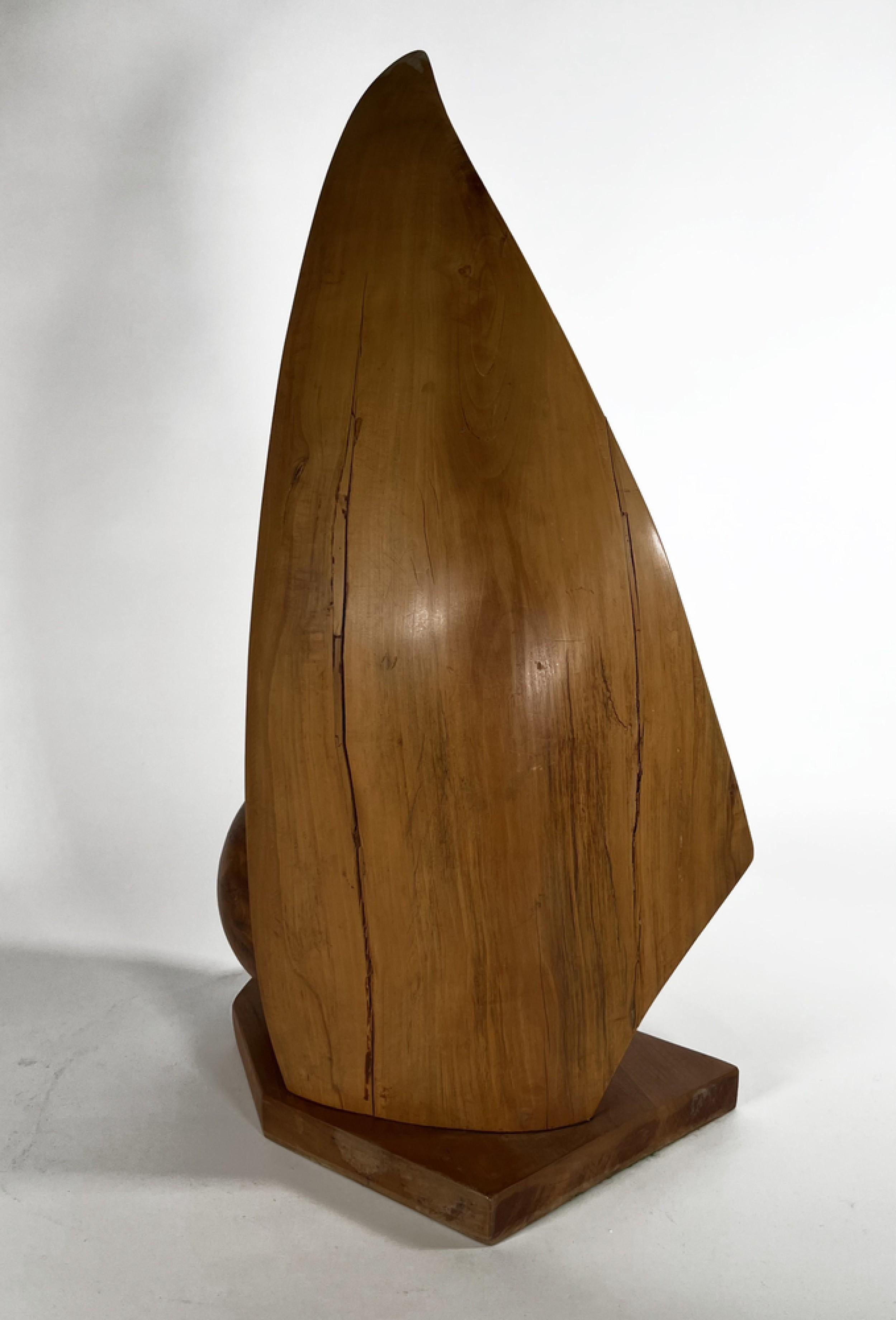 Mid-Century Modern Abstract Wood Sculpture having a wing form with a sphere resting on a triangular base (Raul Varneric, Argentine)