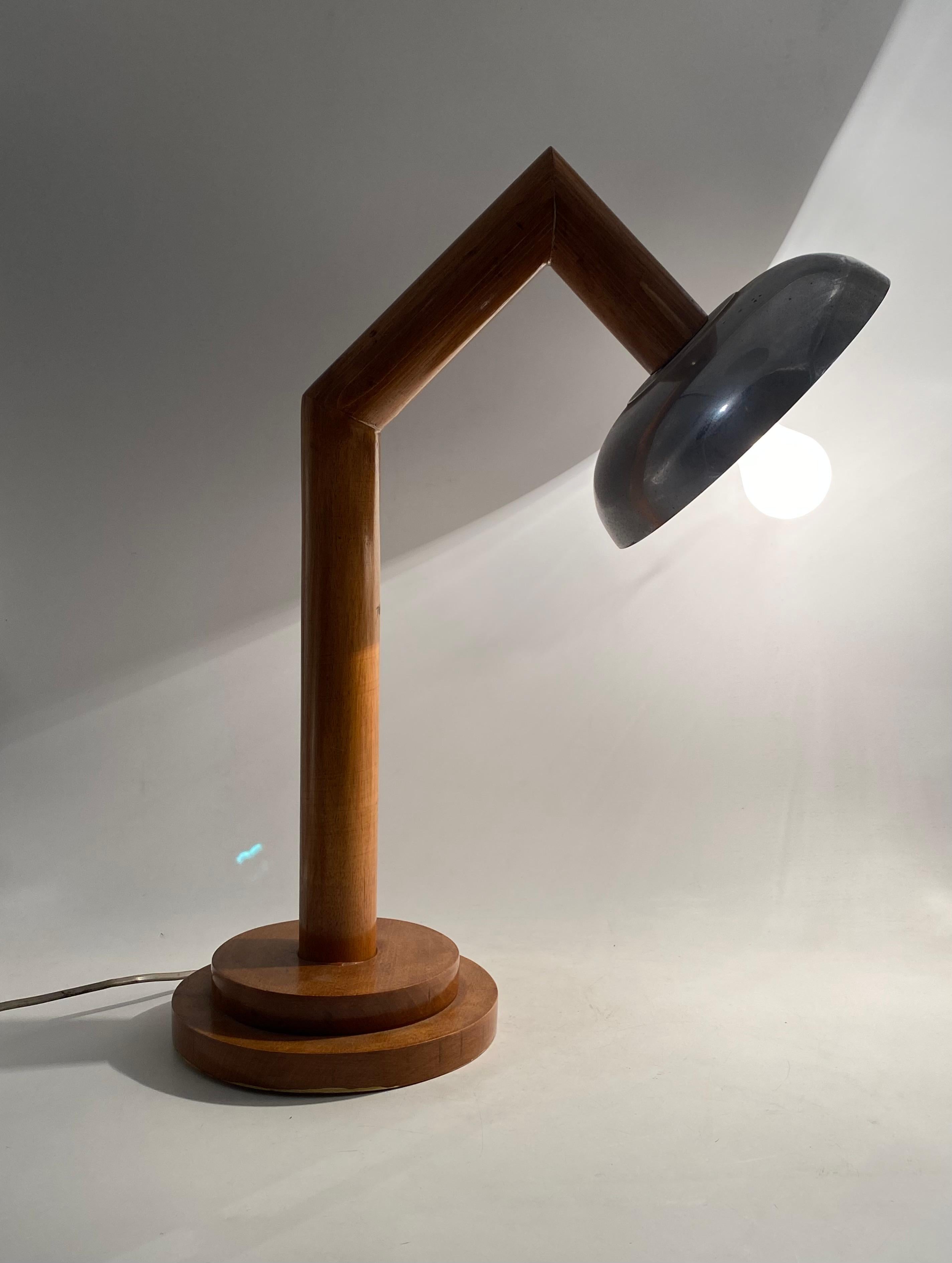 Modern wood table lamp

France circa 1940s

aluminum, wood

H 57 cm - 44 x 24 cm

Conditions: excellent consistent with age and use