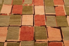 Tappeto tibetano moderno in lana e seta con disegno geometrico in verde e arancione